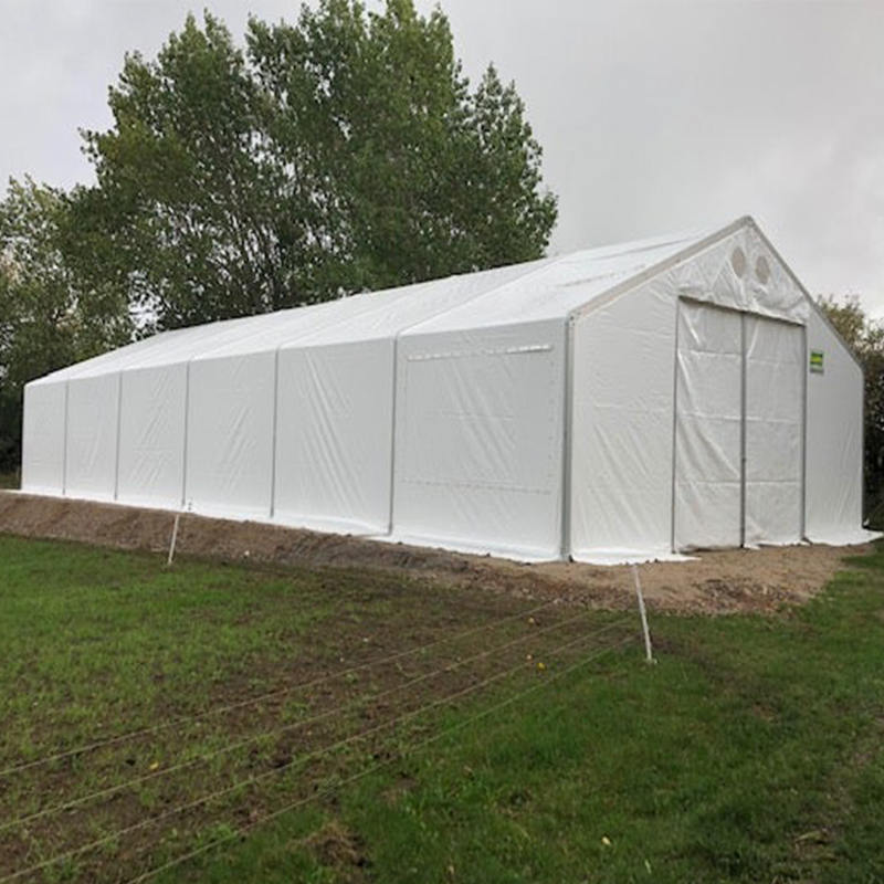 IFRC/ICRC/WFP/IOM vakiopaloa hidastavat UV-suojatut 10 x 24 m:n teltan siirrettävät säilytysyksiköt (MSU)